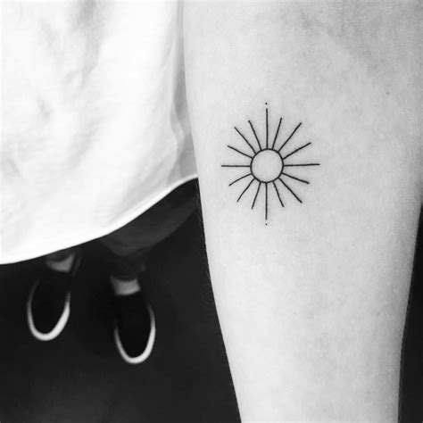 Sun tattoo minimalist - Jun 24, 2021 · The ethos of minimalism is that “less is more.”. Clean, crisp, and timeless, tattoos in this style often feature graphic lines, geometric shapes, and subtle dot work. Many minimalist tattoo artists are opting for single needles rather than multi-needle machines. This allows them to render ultra-delicate designs that often look like ... 